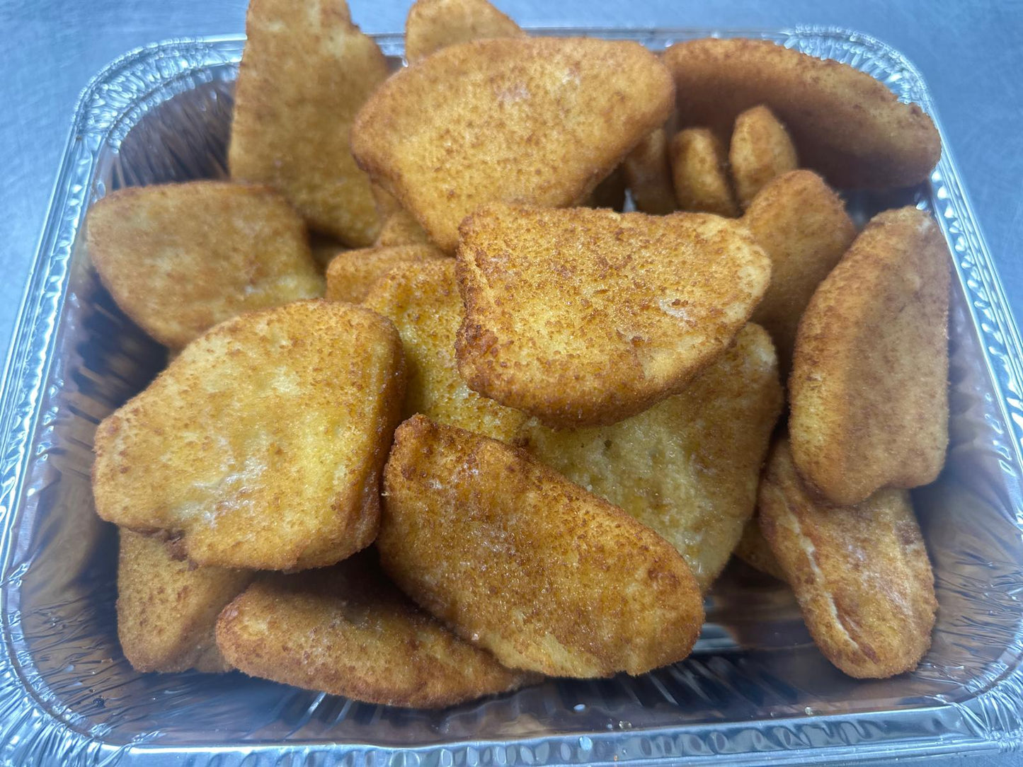 J) Filete de Pescado Empanizado/Breaded Fish Fillet